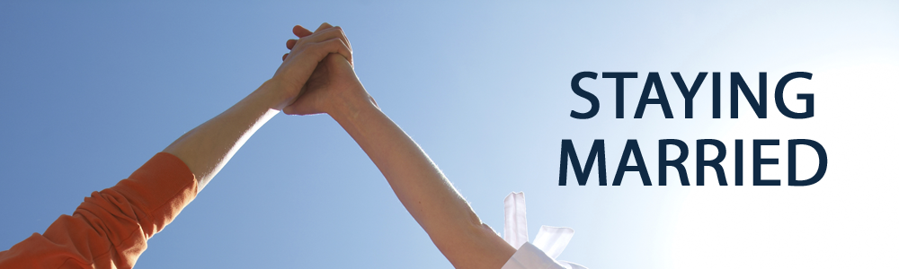 Two people holding their arms towards the sky, with staying married written in navy blue beside them.